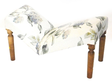 A beech stool, upholstered in floral fabric on turned legs.