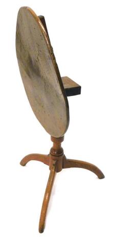 A country made elm and ash occasional table, the circular tilt top on a turned column and tripod base, 58cm dia.