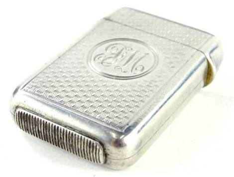 A late Victorian silver Vesta case, with engine turned decoration and engraved monogram to the circular cartouche, London 1887 by F.B Macrae, 34.1g.