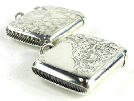 Two similar silver Vesta cases, each engraved with ferns, Birmingham 1905, made by Rombert Chandler, 16.2g and Birmingham 1912, made by T Heatley, 14.7g respectively. (2)