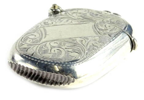 A George V silver Vesta case, of rectangular form with rounded corners, engraved with scrolls around a vacant rectangular cartouche, Chester 1915 by J and R Griffin, 21.6g.