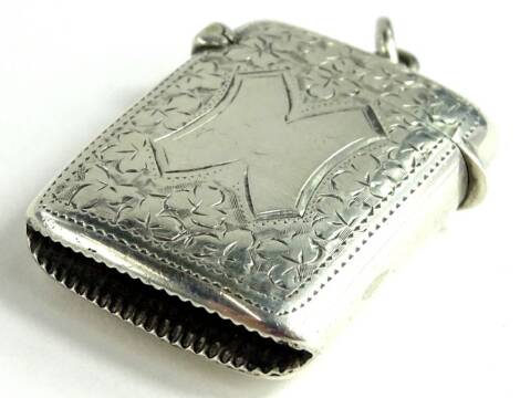 A late Victorian silver Vesta case, engraved with leaves round a large H shaped cartouche, Birmingham 1897 by William Hutchinson, 19.1g.