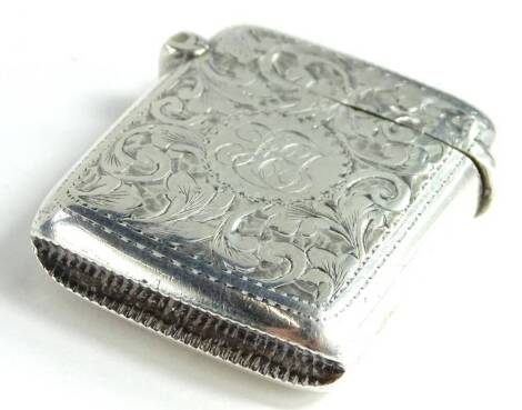 An Edwardian silver Vesta case, engraved overall with scrolls around a circular cartouche containing a monogram, Birmingham 1901 by A and J Zimmerman, 28g.