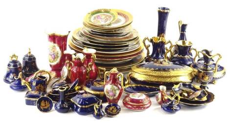 A large quantity of Limoges transfer printed porcelain, to include boxes and covers, plates, ewers, etc.