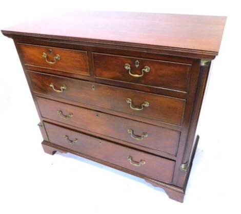 A 19thC mahogany chest of drawers, the rectangular top with a reeded edge above two short and three long drawers, with reeded pilasters, headed by brass capitals on bracket feet, 119cm wide.