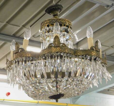 A basket type gilt metal chandelier, possibly Waterford, suspended with prismatic and other drops, 55cm H.