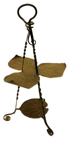 An unusual Art Nouveau copper and wrought iron cake stand, with triple petal effect stand to the top above a further under tier, on scroll supports.