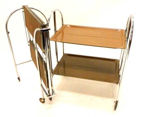 Two similar 1960s/70s melamine and chrome plated folding trolleys, in retro style.