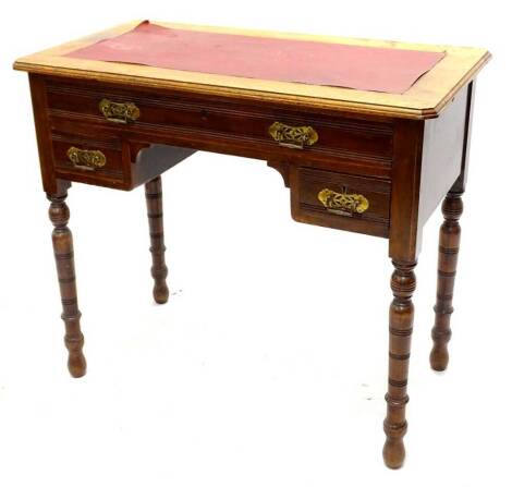 A late 19th/early 20thC walnut writing table, the rectangular top with red leatherette inset above a frieze drawer and two short drawers on turned tapering legs, 83cm W.