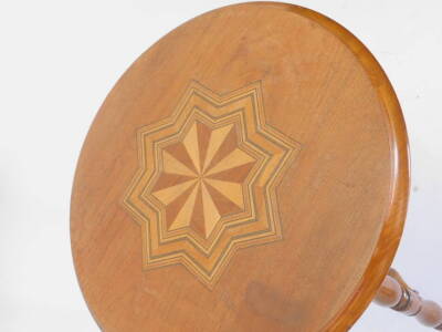 A late/early 20thC walnut gypsy table, the circular top inlaid with a specimen timber star, on turned supports, 46cm dia. - 2