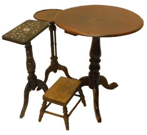 A collection of furniture, to include an Edwardian mahogany occasional table, the circular dish top on three turned supports and tripod base, another similar occasional table, Eastern mother of pearl inlaid table and a stool. (4)