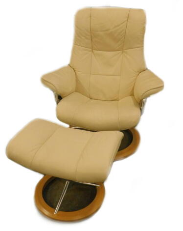 A Stressless cream leather and metal swivel armchair, and matching stool.