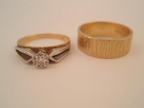 A solitaire diamond ring set with a small diamond in illusion setting in 18ct gold