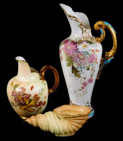 A Royal Worcester ewer, handpainted and raised with flowers, with gilt highlights, shaped handle and bead lined foot, no. 1587, green printed marks beneath, 1900, 24cm H, a Royal Worcester shell no. G716 and a Royal Worcester jug no. 1094. (3)