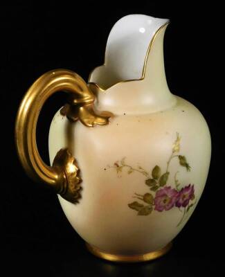 A Royal Worcester ewer, handpainted and raised with flowers, with gilt highlights, shaped handle and bead lined foot, no. 1587, green printed marks beneath, 1900, 24cm H, a Royal Worcester shell no. G716 and a Royal Worcester jug no. 1094. (3) - 7