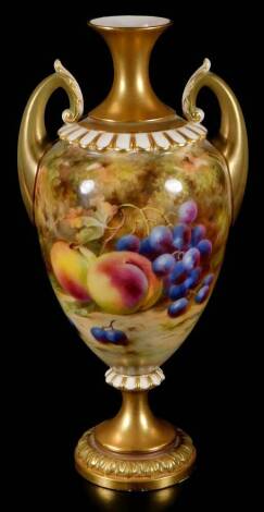 A Royal Worcester Frank Roberts urn vase, the tapering body handpainted with peaches and grapes, with gilt highlights, inverted neck and stem, acanthus capped handles and circular foot, no. H313, pink printed marks beneath, 1917.