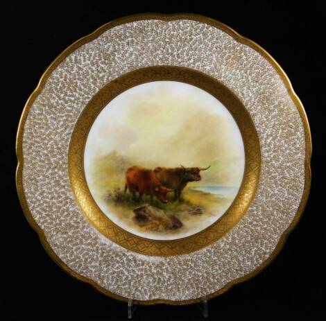 A Royal Worcester John Stinton highland cattle handpainted plate, of floral form with gilt highlights and a floral border, centred by two highland cattle in a Highland scene, signed, pink and green marks beneath, 1917, 27cm W.