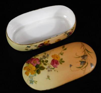 A Royal Worcester blush ivory hair grip box and cover, puce factor mark, c1913, 10cm L, together with a blush ivory miniature cup and saucer, green factory mark, saucer 8cm Dia. (2) - 3