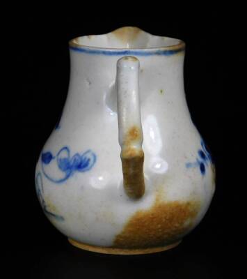 A early Bow Porcelain sparrow jug, c1756, with crabstock handle painted in vivid blue with the Prunus Fence pattern, 7cm H. - 4