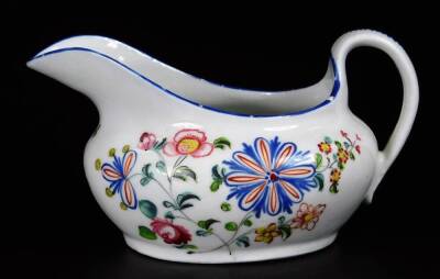 A Newhall clip handle creamer, c1780, 10cm H, together with a low creamer decorated with a flower group below a blue rim, pattern no 940, 14cm W. (2) - 2