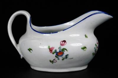 A Newhall clip handle creamer, c1780, 10cm H, together with a low creamer decorated with a flower group below a blue rim, pattern no 940, 14cm W. (2) - 4