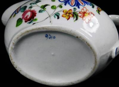 A Newhall clip handle creamer, c1780, 10cm H, together with a low creamer decorated with a flower group below a blue rim, pattern no 940, 14cm W. (2) - 7