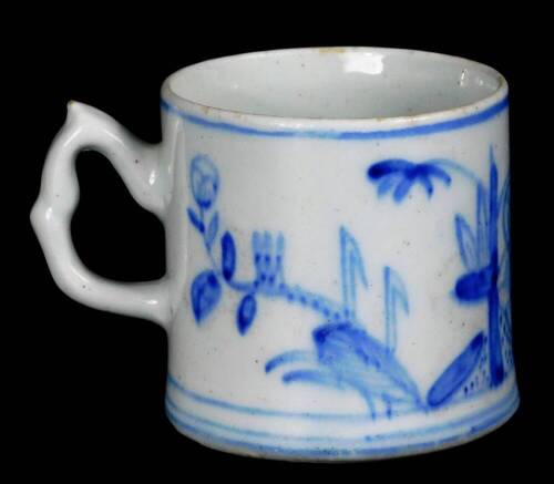 A early Bow porcelain coffee can, c1756/58, with crabstock handle, decorated with a prunus and bamboo landscape, unglazed, 5.5cm H.