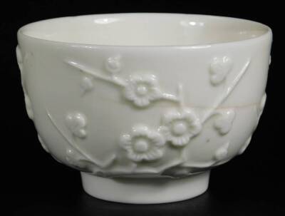 A St Cloud Porcelain or Mennecy Trembleuse tea bowl and saucer, c1748, decorated with moulded stylized blossoms, tea bowl 9cm Dia., saucer 13cm Dia. - 6