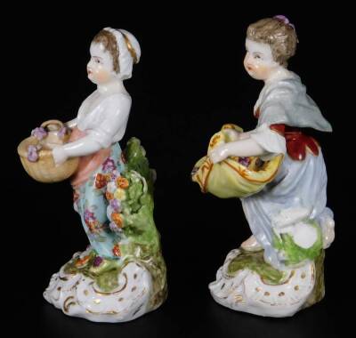 A pair of mid 19thC continental porcelain salt seller figures, of girls holding apron or basket, marked A/R, 12cm H. - 2