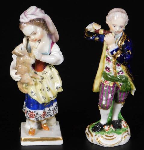 A 19thC Derby porcelain figure of a girl holding a sheep, in red, marked 23, 12cm H, together with a Derby model of a gallant playing a pipe, incised no.10 and 33, gilder no.60 12cm H. (2)