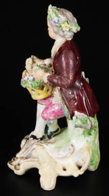 A Derby porcelain figure of a gallant, c1775, holding a basket of flowers, on a rococo base, incised 190 size 2, 12cm H. (AF) - 2