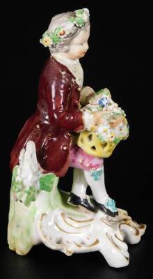 A Derby porcelain figure of a gallant, c1775, holding a basket of flowers, on a rococo base, incised 190 size 2, 12cm H. (AF) - 4