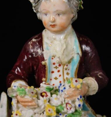 A Derby porcelain figure of a gallant, c1775, holding a basket of flowers, on a rococo base, incised 190 size 2, 12cm H. (AF) - 6