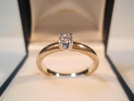 A solitaire stone set ring