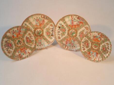 A pair of 19thC Cantonese famille rose plates decorated with figures on