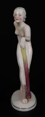 A continental Art Deco figure of a nude female, holding a spotted cloth on oval foot, marked HA beneath, 30cm H. - 2