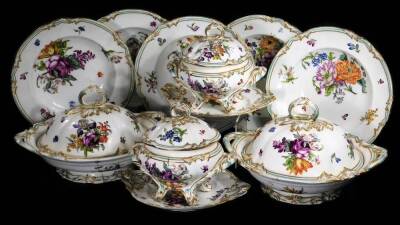 A 19thC continental porcelain part dinner service, each piece profusely decorated with handpainted flowers predominately in blue, green and orange, to include two lidded tureens, 30cm W, a pair of sauce dishes and covers, serving dishes, plates, etc. each