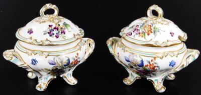 A 19thC continental porcelain part dinner service, each piece profusely decorated with handpainted flowers predominately in blue, green and orange, to include two lidded tureens, 30cm W, a pair of sauce dishes and covers, serving dishes, plates, etc. each - 6