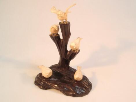 A Japanese carved ivory group of five finches