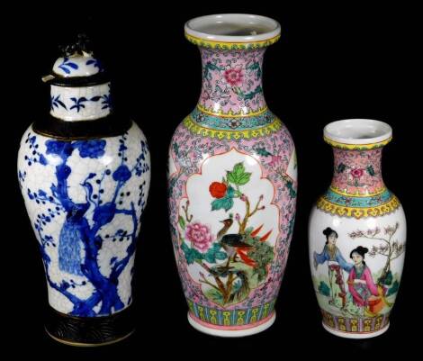 A 20thC Chinese porcelain vase, of shouldered form, decorated with panels of exotic birds in a naturalistic setting, predominately in pink and yellow, 32cm H, a Republic porcelain vase decorated with figures in a landscape, and a blue and white Ming type 