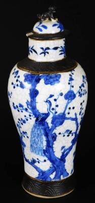 A 20thC Chinese porcelain vase, of shouldered form, decorated with panels of exotic birds in a naturalistic setting, predominately in pink and yellow, 32cm H, a Republic porcelain vase decorated with figures in a landscape, and a blue and white Ming type - 12
