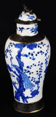 A 20thC Chinese porcelain vase, of shouldered form, decorated with panels of exotic birds in a naturalistic setting, predominately in pink and yellow, 32cm H, a Republic porcelain vase decorated with figures in a landscape, and a blue and white Ming type - 14