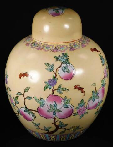 An early 20thC jar and cover, of large proportion, the domed lid and body similarly decorated with flowers predominately in pink and green on a cream ground, marked beneath, 38cm H.