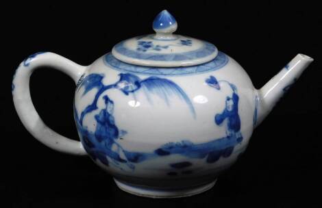 A Chinese export porcelain teapot, of small proportion, the compressed circular body and circular lid decorated with figures and flowers with a upper geometric banding, with plain handle and spout picked out with further flowers, on a circular foot, unmar