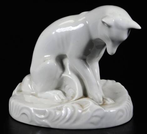 A Porsgrund Norwegian figure of a fox, glazed but undecorated, printed mark and numbered 60 beneath, 15cm H.