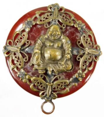 An early 20thC Chinese pendant, on a polished stone ground, raised with a figure of Buddha, surrounded by pierced flowers and scrolls, with a plain ring top, 5cm H. - 2