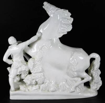 A Russian Verbilki white porcelain figure group of a rearing horse and master, on a floral ground, red stamped mark beneath, 27cm H. - 3