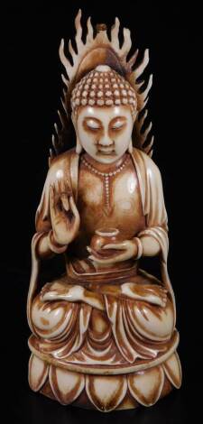 A Chinese ivory figure of a Buddha, sitting on a lotus leaf, two character mark.