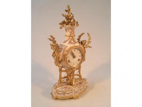 A modern French porcelain and gilt metal mounted mantel clock