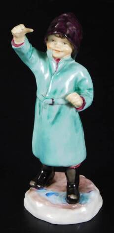 A Royal Worcester figure, representing February's child, wearing a green rain coat, no. 3453, by F.C. Doughty, black marked, 16cm H.